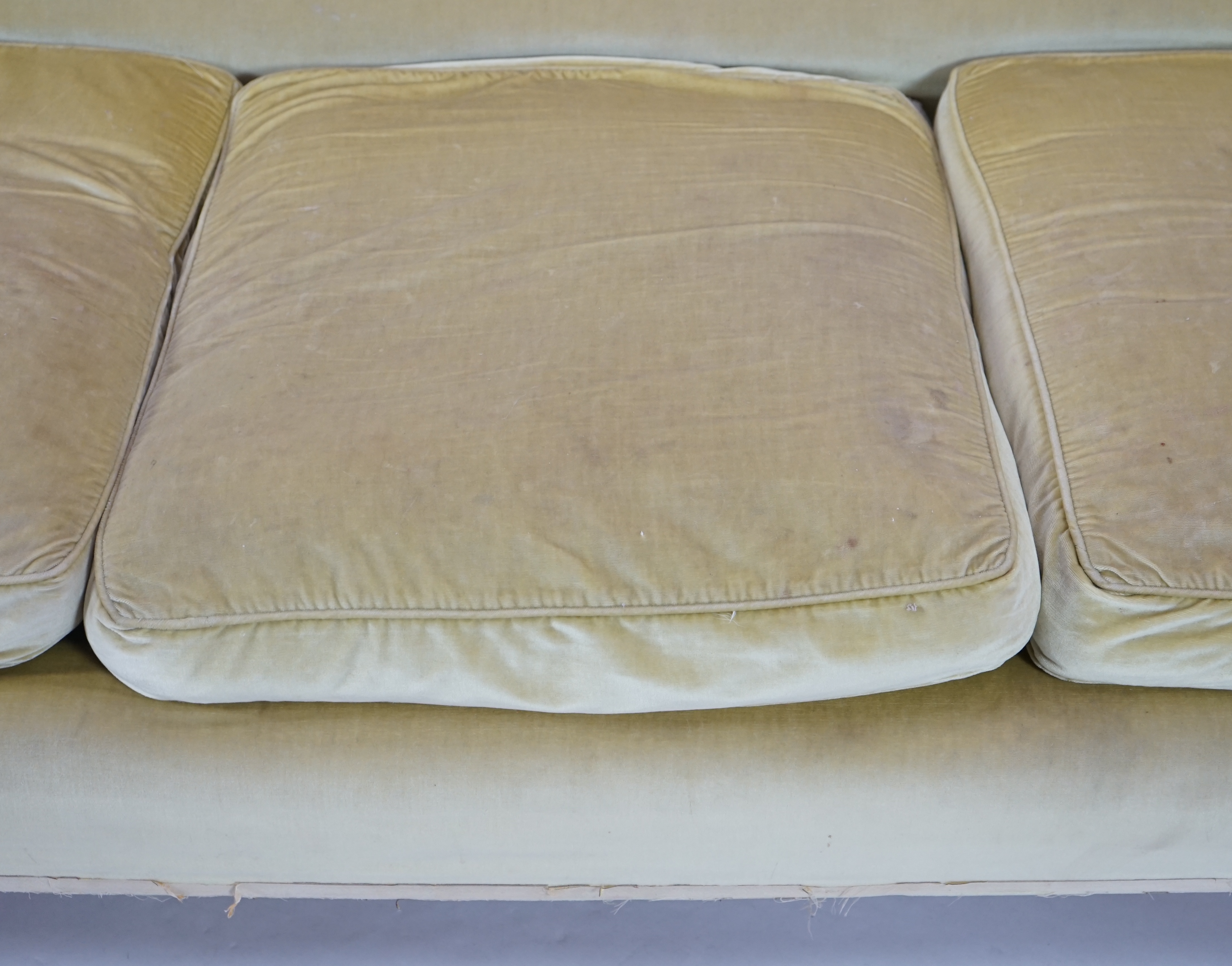 A large Victorian sofa, in the manner of Howard & Sons, probably Swietenia mahagoni with a Fagus sylvatica frame